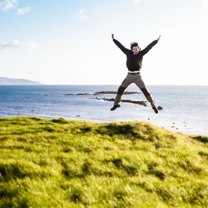 Man jumps in the air for joy