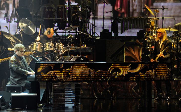 Elton John plays his "Million Dollar Piano," Blossom, in 2011.