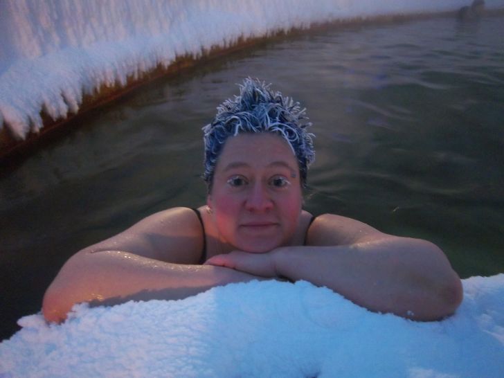 Person in hot tub with frozen hair.