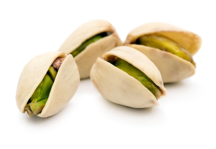 Four pistachios in their shells