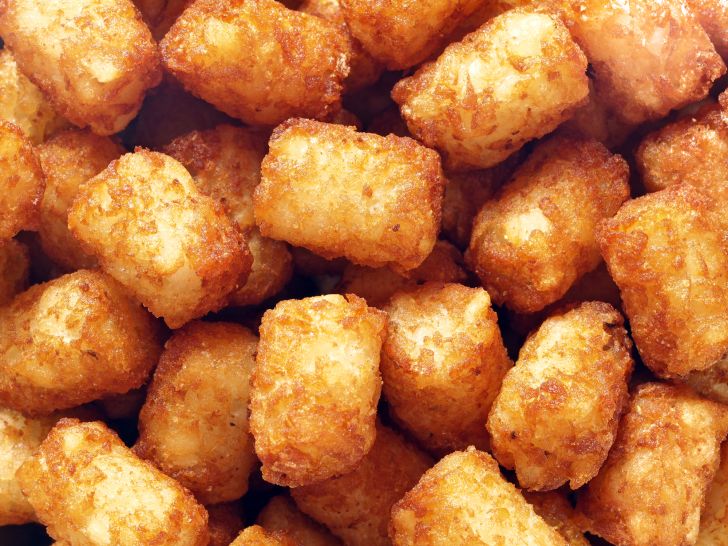 A pile of golden brown tater tots