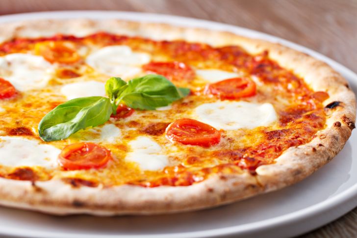 A margherita pizza fresh from the oven