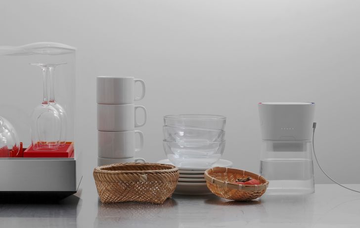 A Duo carafe on a counter with dishware