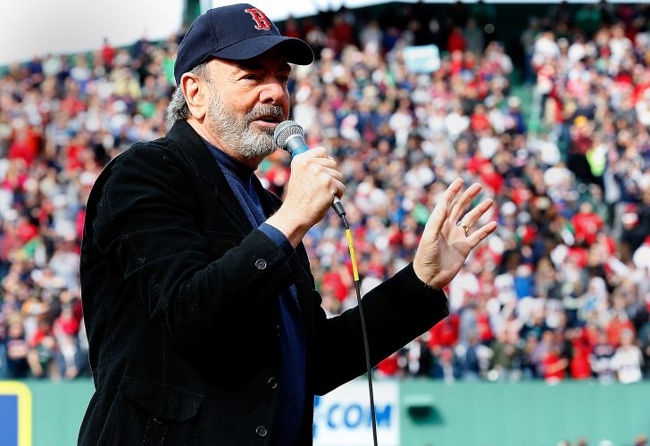 Neil Diamond sings 'Sweet Caroline' during a game between the Kansas City Royals and Boston Red Sox in the 8th inning at Fenway Park on April 20, 2013 in Boston, Massachusetts