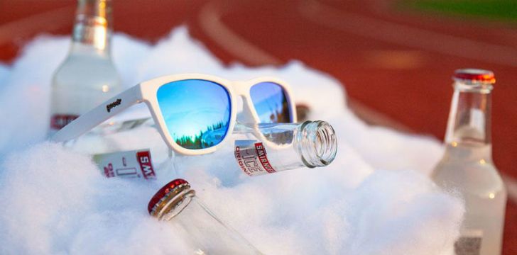 A pair of Goodr OG sunglasses sit on top of a beer cooler