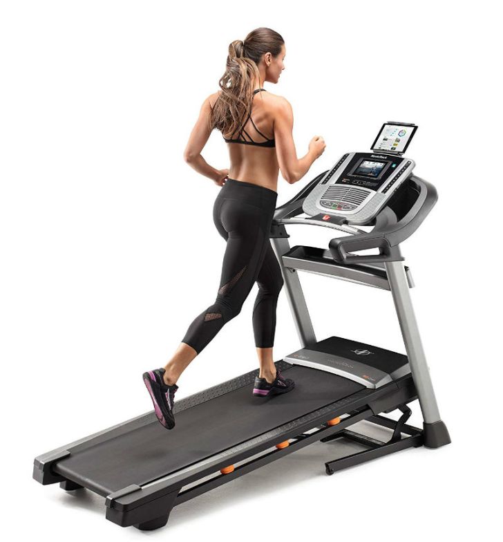 A woman runs on the NordicTrack C990 treadmill
