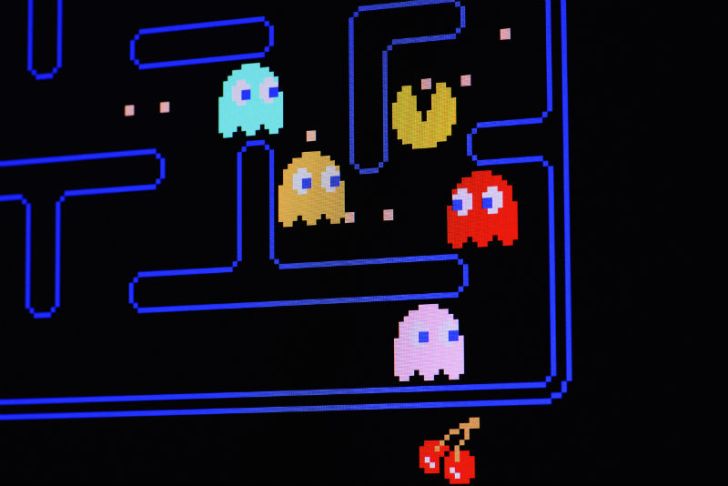 A 'Pac-Man' video game screen is shown