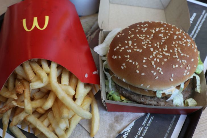 A Big Mac sits next to an order of McDonald's fries