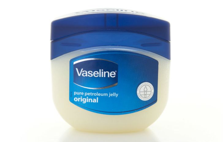 A jar of Vaseline sits unopened