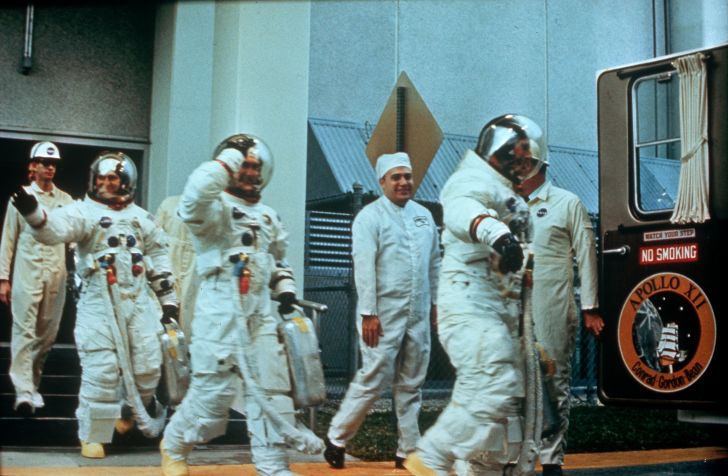 Astronauts Pete Conrad, Richard F Gordon Jnr, and Alan L Bean getting ready to go to the moon on the Apollo 12 mission.