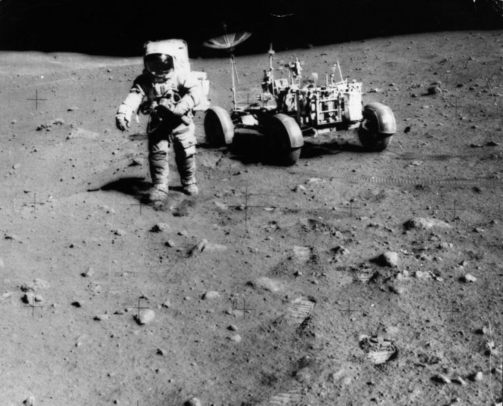 Apollo 15 Astronaut James Irwin on the moon with a moon buggy.
