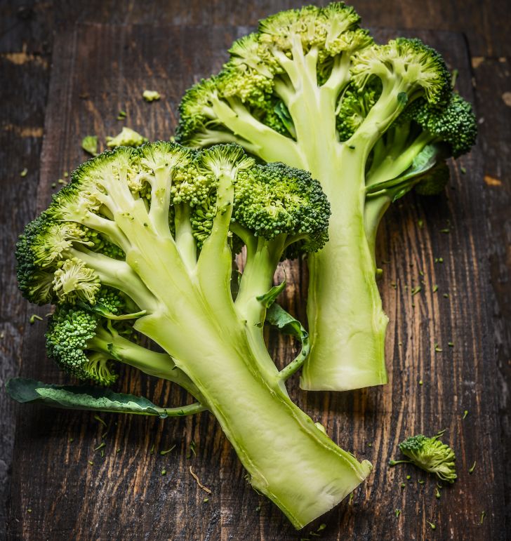 Broccoli stalk cut in half.