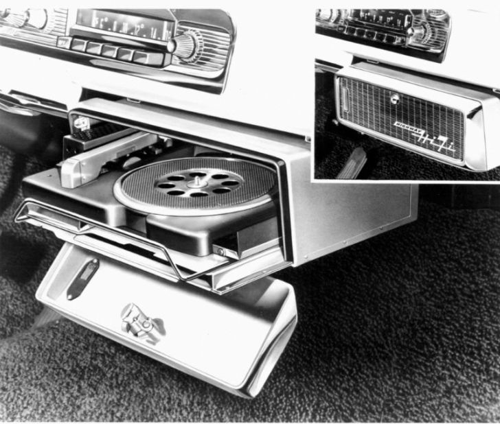 A Chrysler car record player mounted under the dashboard