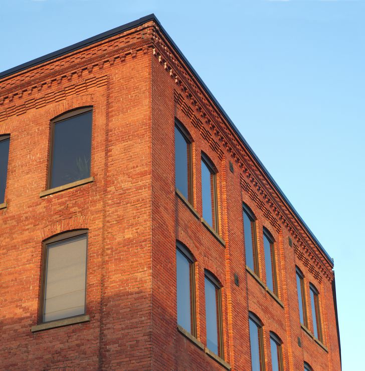 brick building against blue sky