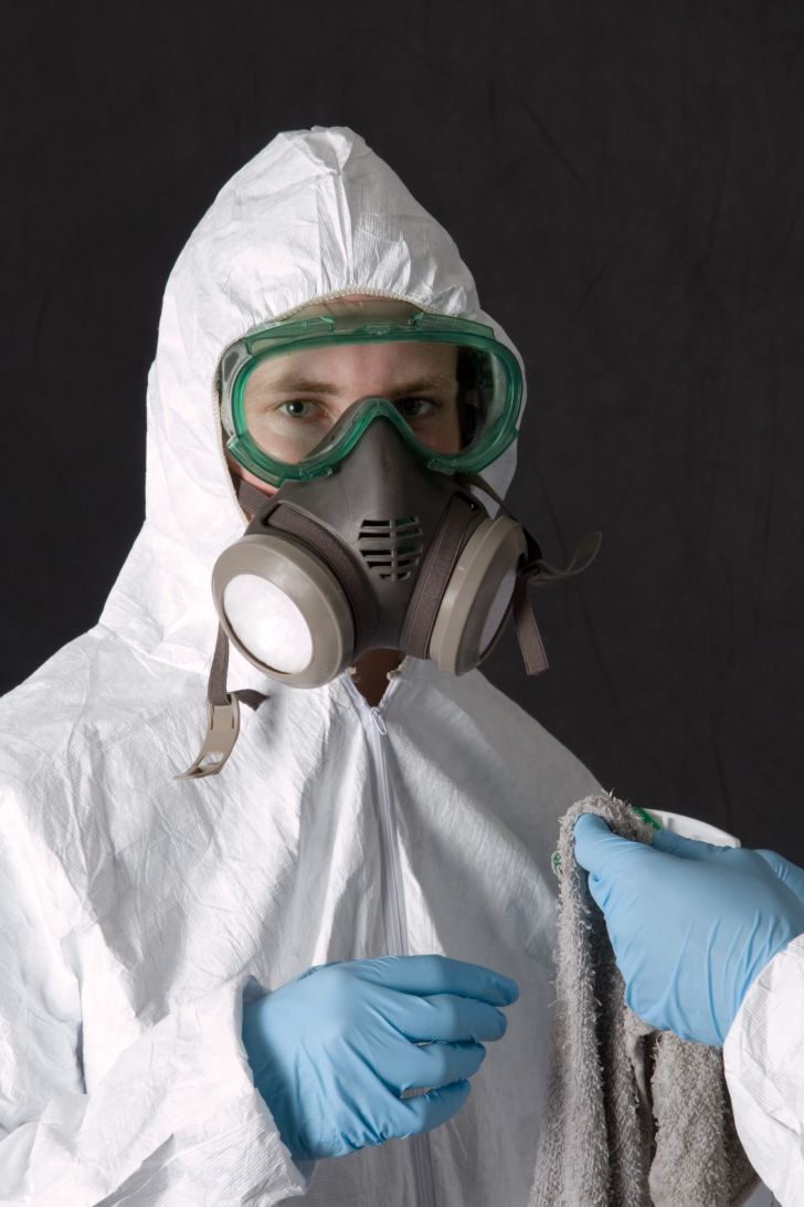 A person dressed in personal protective equipment