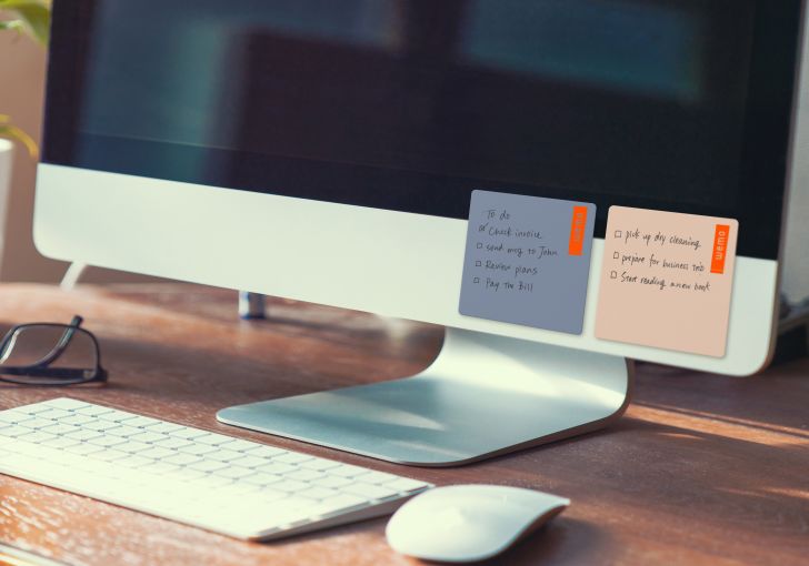 Notepads on computer monitor.