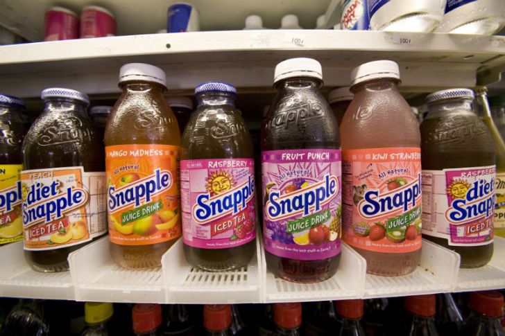 Bottles of Snapple line a store shelf