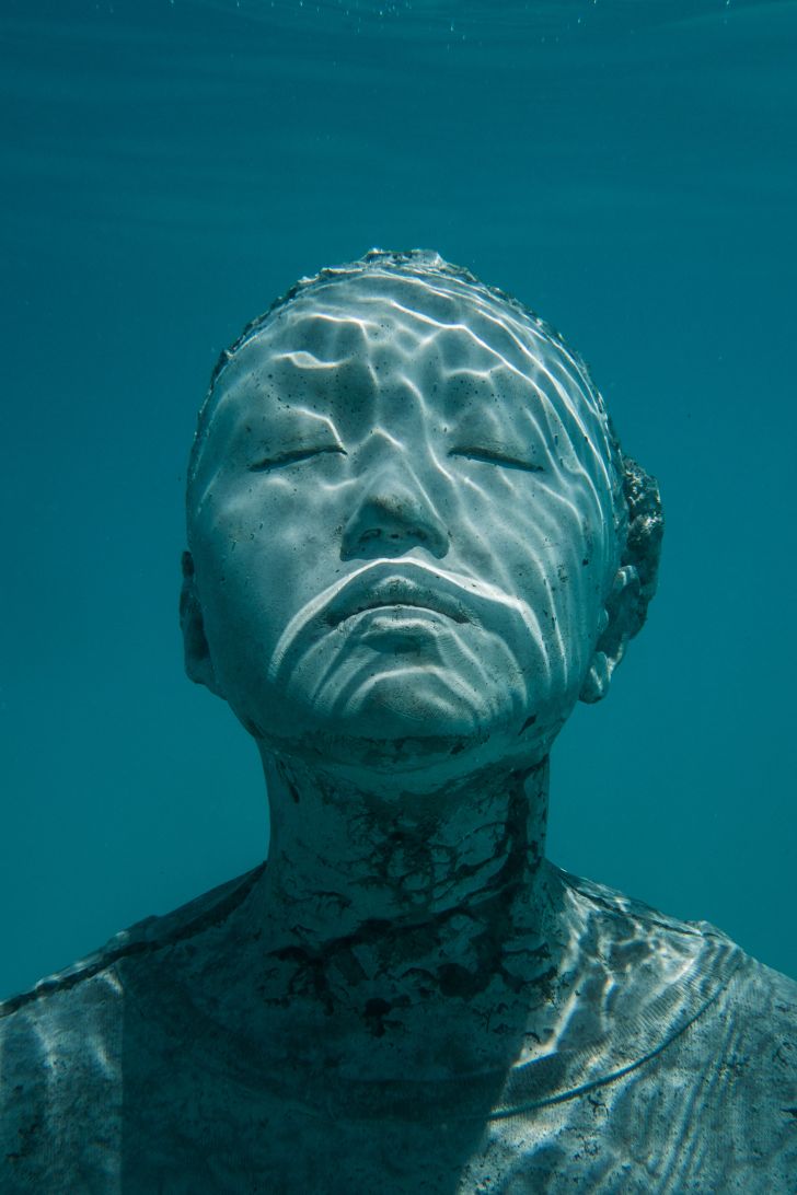 An underwater sculpture of a person