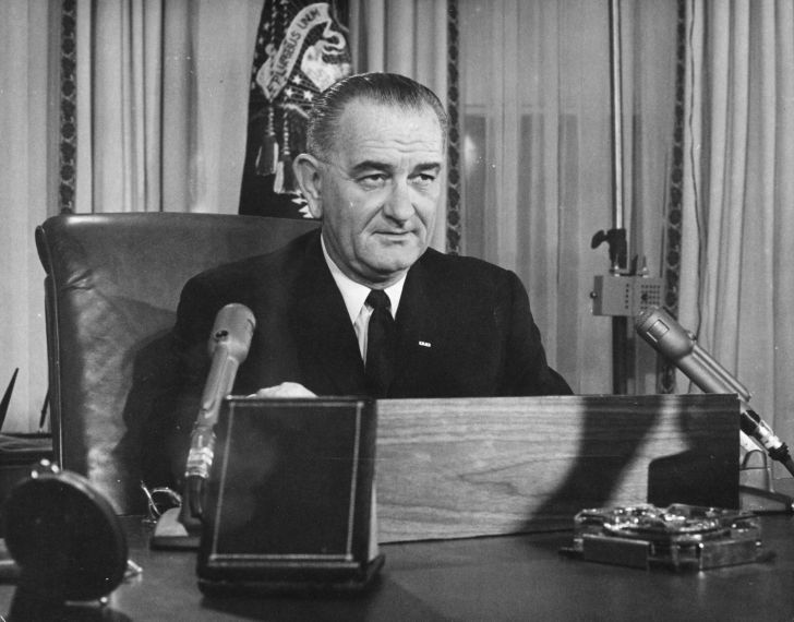 American President Lyndon Baines Johnson addresses the nation on his first thanksgiving day television programme, broadcast from the executive offices of the White House
