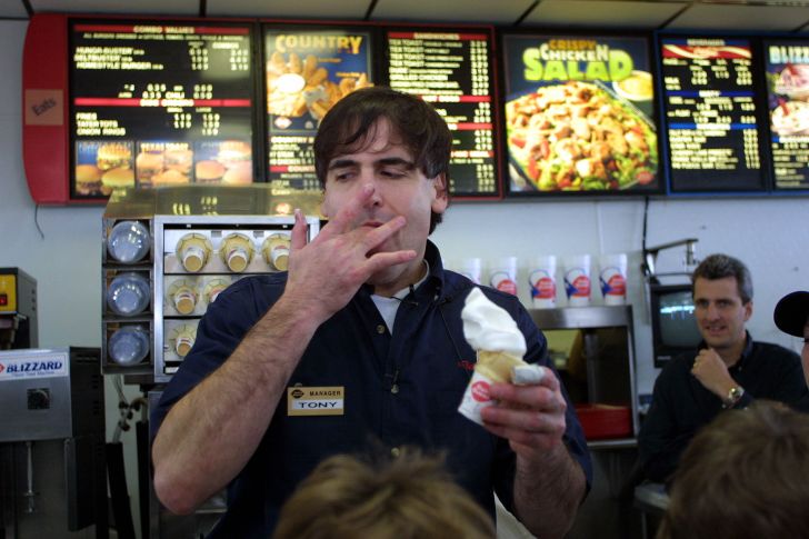 image of Mark Cuban at a DQ restaurant holding an ice cream cone and wearing a nametag that says "Tony"
