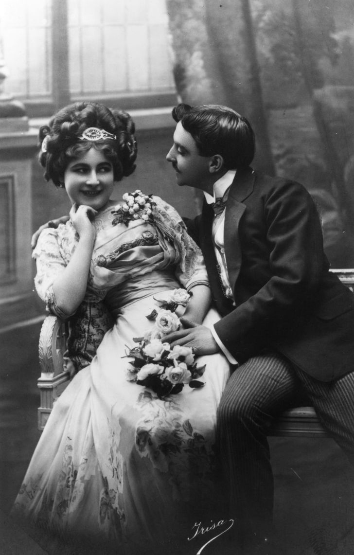 A courting Victorian couple fawning over each other