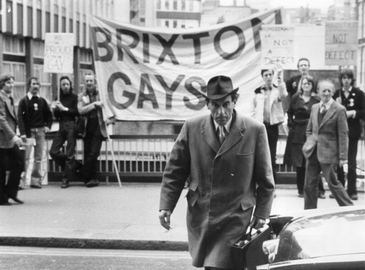 Ex leader of the Liberal party and ex MP, Jeremy Thorpe arriving at the Old Bailey where he is being tried on charges of conspiracy and incitement to murder. In the background are gay rights supporters who object to the way homosexuality has been treated