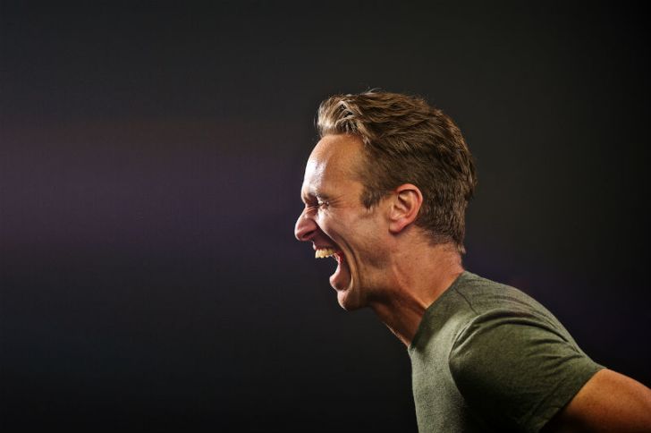 A man laughs hysterically