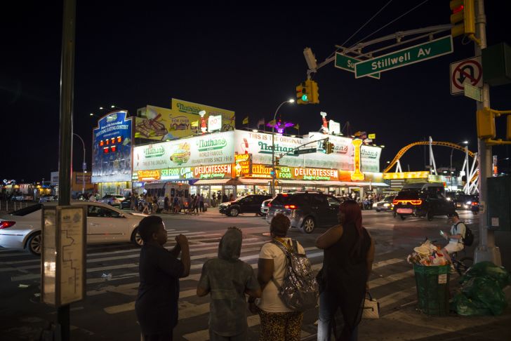 Image of the original Nathan's Famous Coney Island location at night