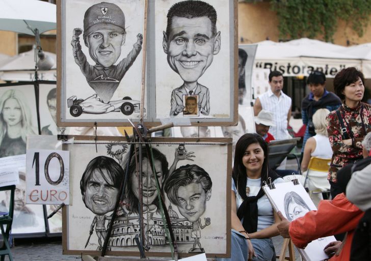 Tourists look at caricaturists in Rome