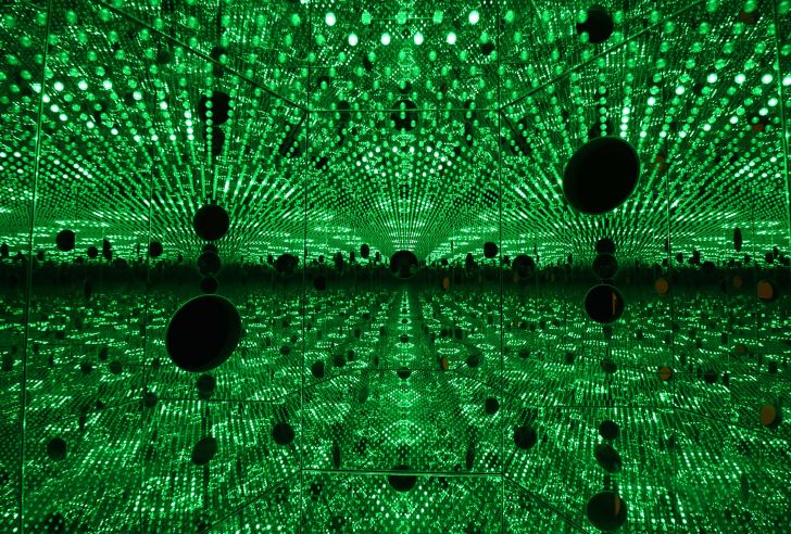 An installation with green lights and mirrors