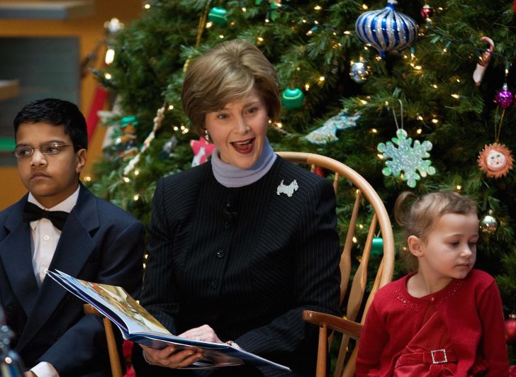 First Lady Laura Bush reads a story about 'Rudolf the Red Nose Reindeer' during a visit to the Children's National Medical Center in 2007.