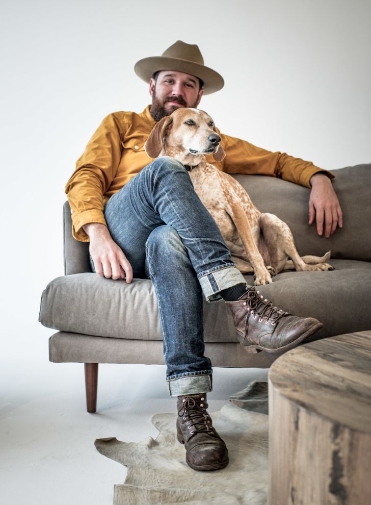 Dog and owner on a couch.