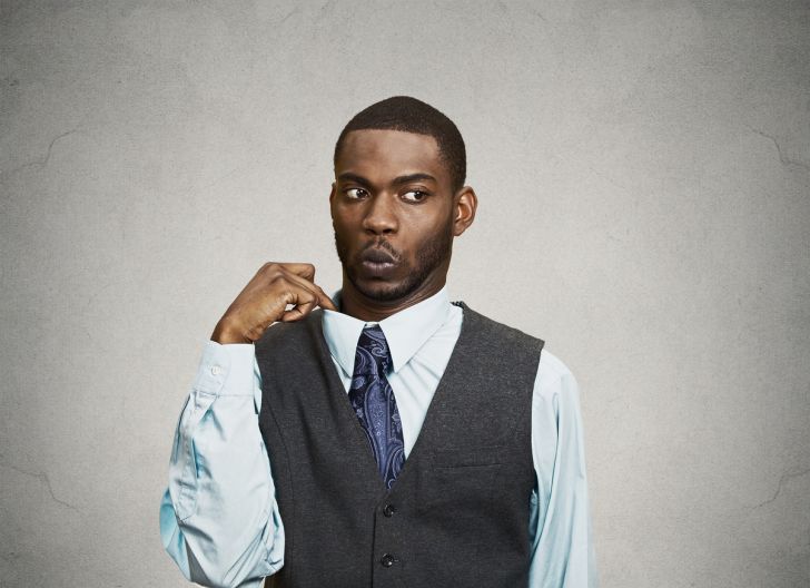 man in suit avoids eye contact