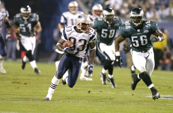 New England Patriots Deion Branch #83 runs with the ball during Super Bowl XXXIX between the Philadelphia Eagles and the New England Patriots at Alltel Stadium in Jacksonville, Florida on February 6, 2005