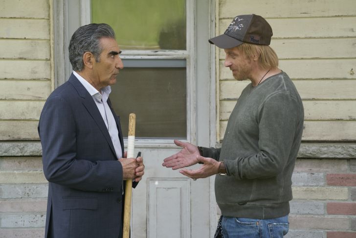 Eugene Levy as Johnny Rose and Chris Elliott as Roland Schitt in Schitt's Creek.