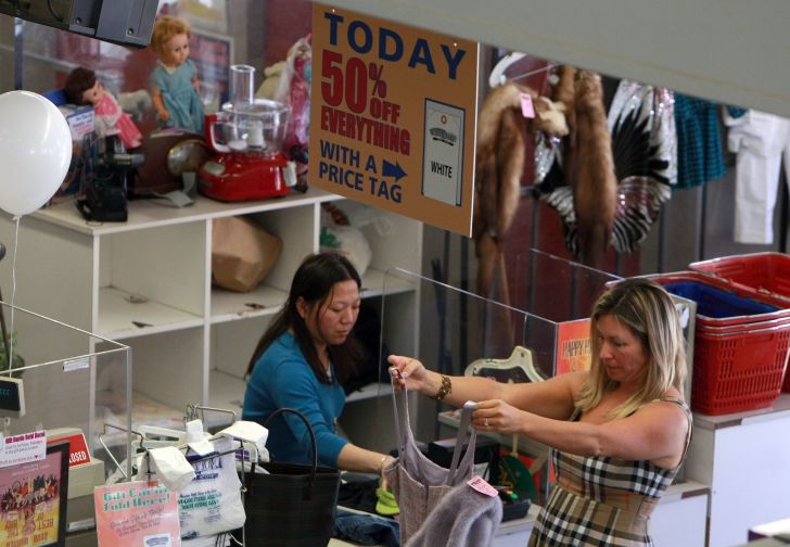 A Thrift Town customer prepares to pay for her merchandise.