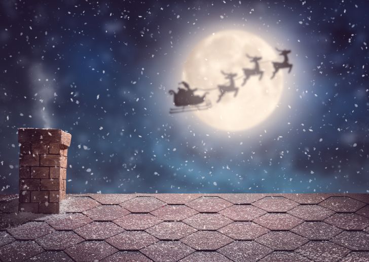 Santa and his reindeer flying