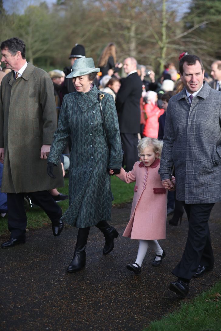 Princess Anne, Princess Royal, Isla Phillips and Peter Phillips attend a Christmas Day church service