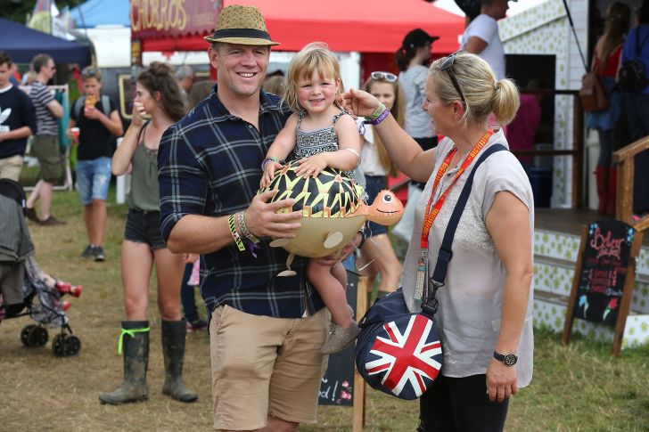 Mike Tindall, Zara Tindall and their daughter Mia Tindall pose for a photograph during day three of The Big Feastival at Alex James' Farm on August 28, 2016 in Kingham, Oxfordshire.