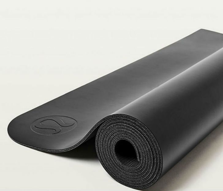 A Lululemon yoga mat appears rolled up