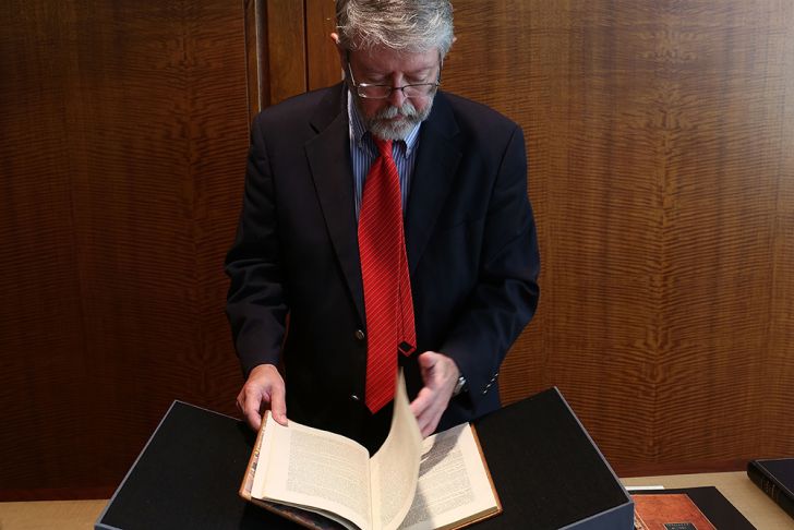 A senior specialist for rare books and manuscripts at Christie's holds a copy of former President George Washington's personal copy of the Constitution and Bill of Rights in 2012 A senior specialist for rare books and manuscripts at Christie's holds a copy of former President George Washington's personal copy of the Constitution and Bill of Rights in 2012
