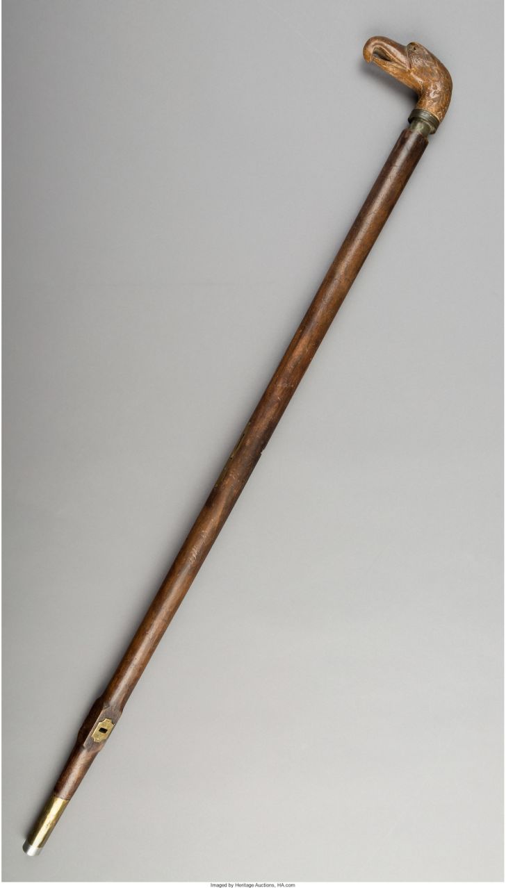 Cane with wooden eagle handle.