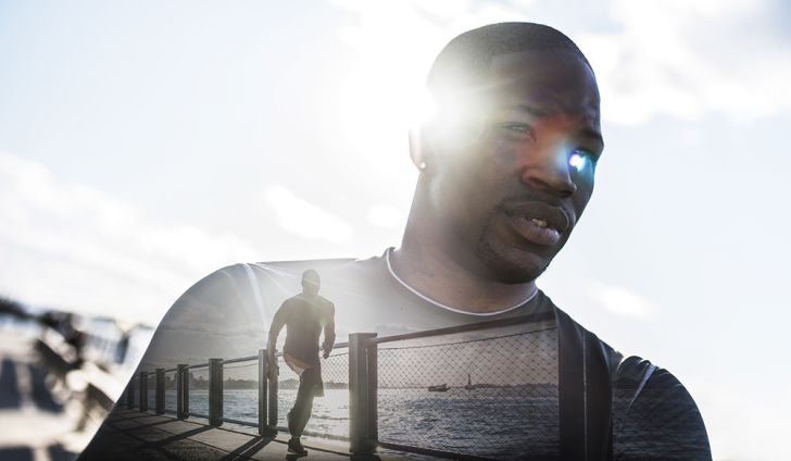 A black man with the silhouette of another man running, as if in his mind's eye