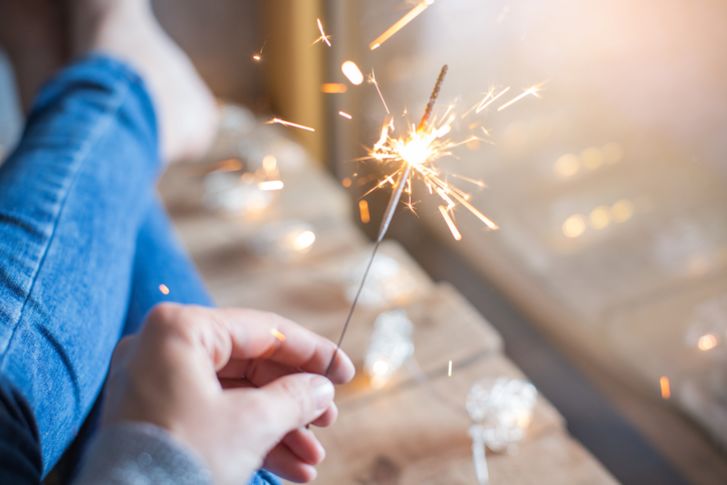 person holding sparkler