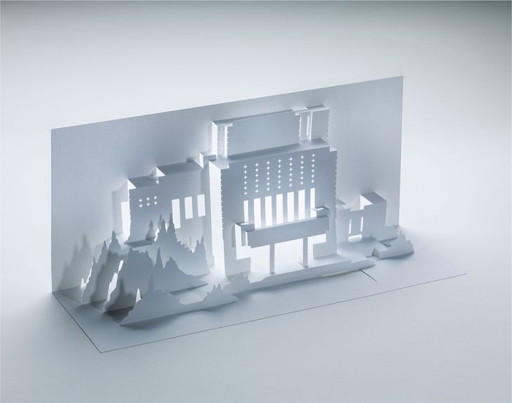 A folded paper cut-out of Frank Lloyd Wright's Millard House