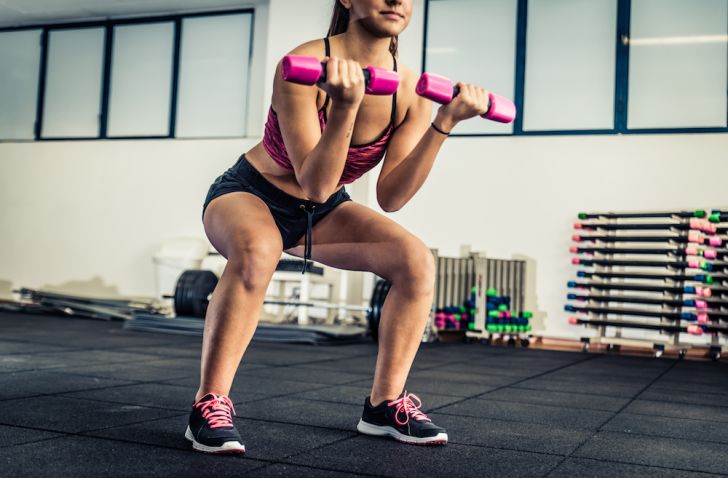 Woman exercising with free weights