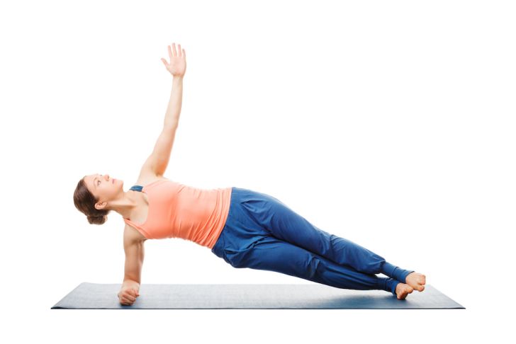 Woman doing a side forearm plank exercise