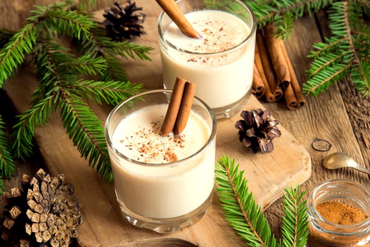 A photo of two glasses of eggnog