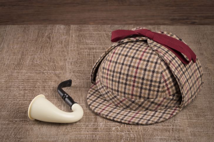 A deerstalker hat and tobacco pipe